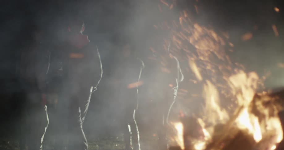 People at a bonfire