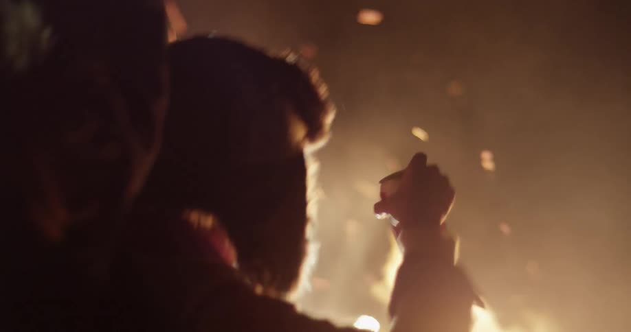 People at a bonfire