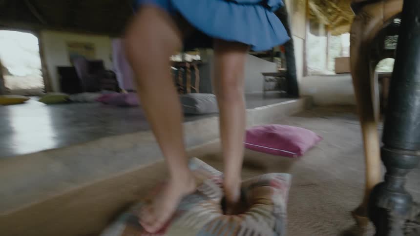 A child walking across cushions