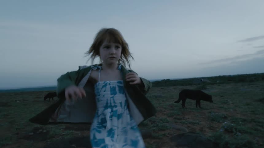 A child is playing outdoors in spring