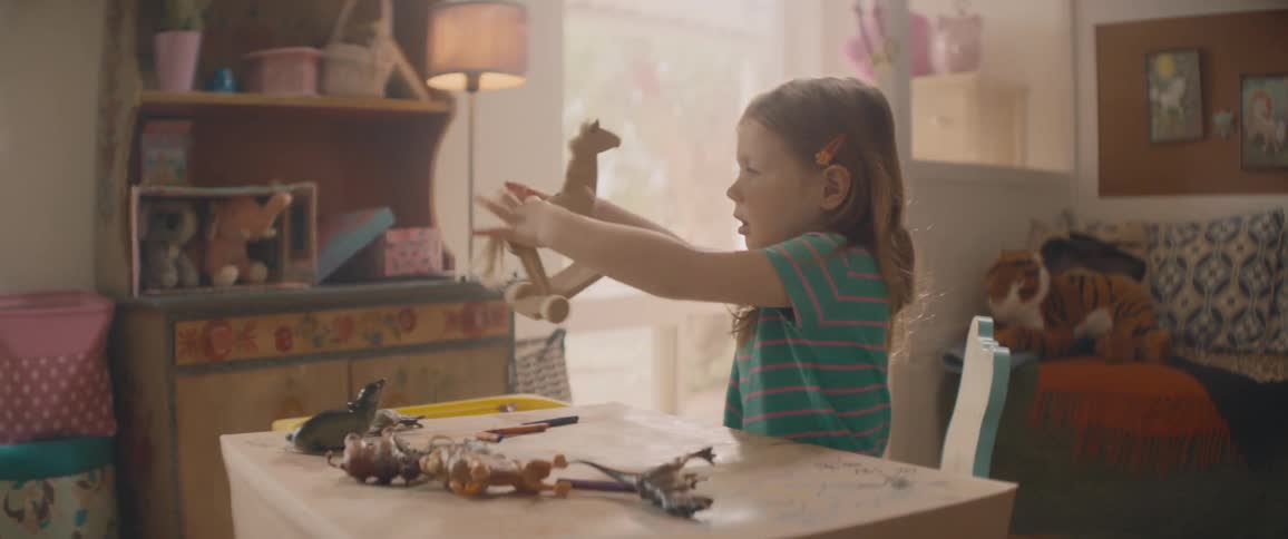 A child playing with a toy indoors
