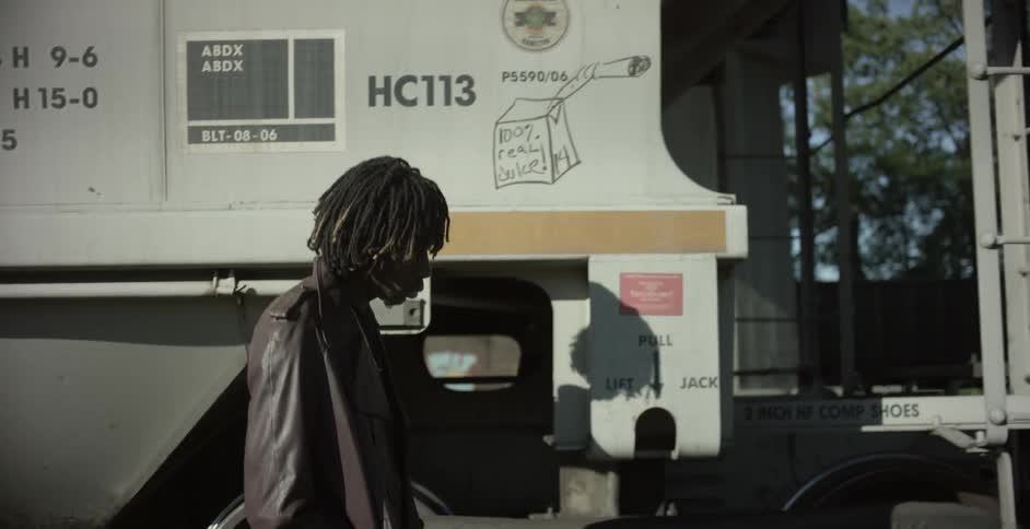 A man walks past train