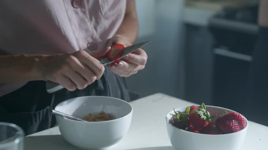 A couple are cooking in the kitchen