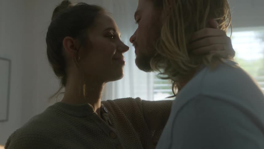 A couple dance and kiss