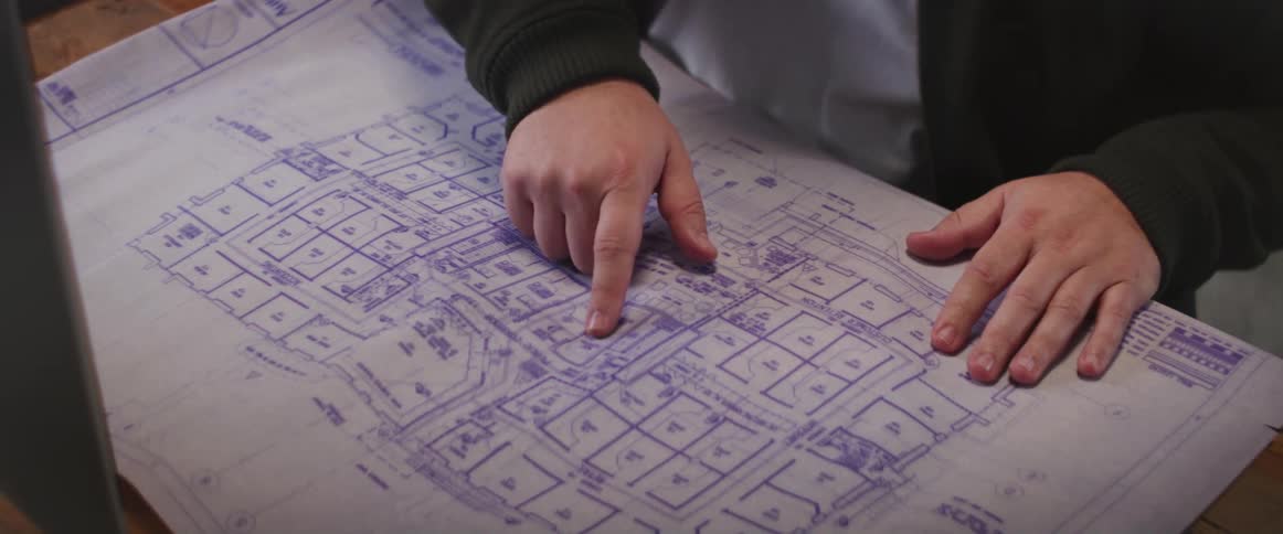 A person is looking at a map diagram