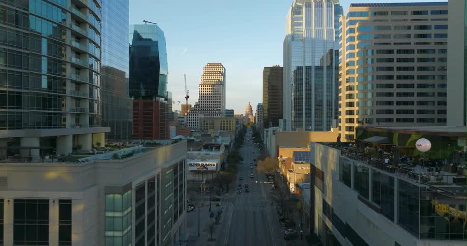 Aerial view of buildings in a downtown city is displayed