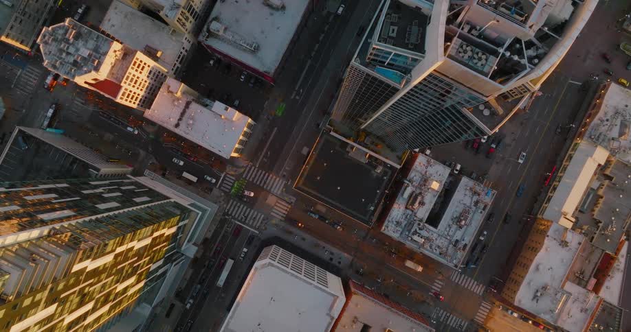 Straight down view of city streets and rooftops