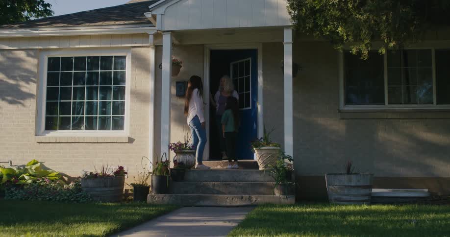 A woman dropping her daughter off at a friends house
