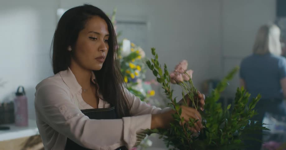 An employee is working in a flower store