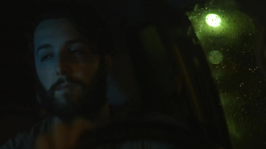 A man driving at night
