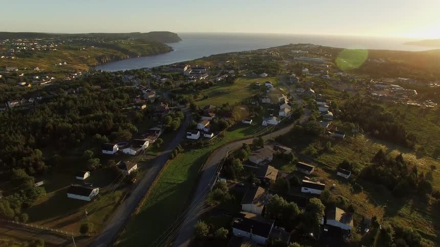 Sunrise over coastal town in Newfoundland drone