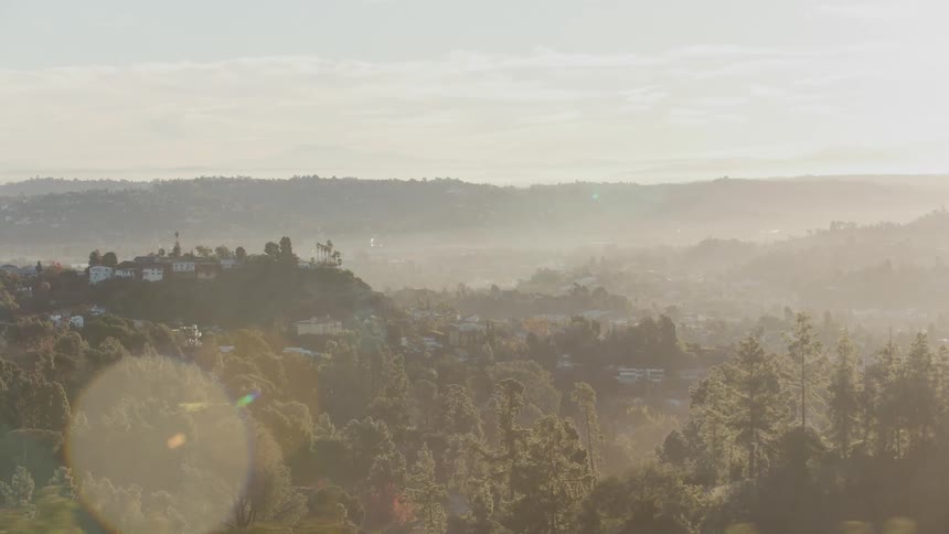 Looking out over homes on the hills and in the valley on a bright day
