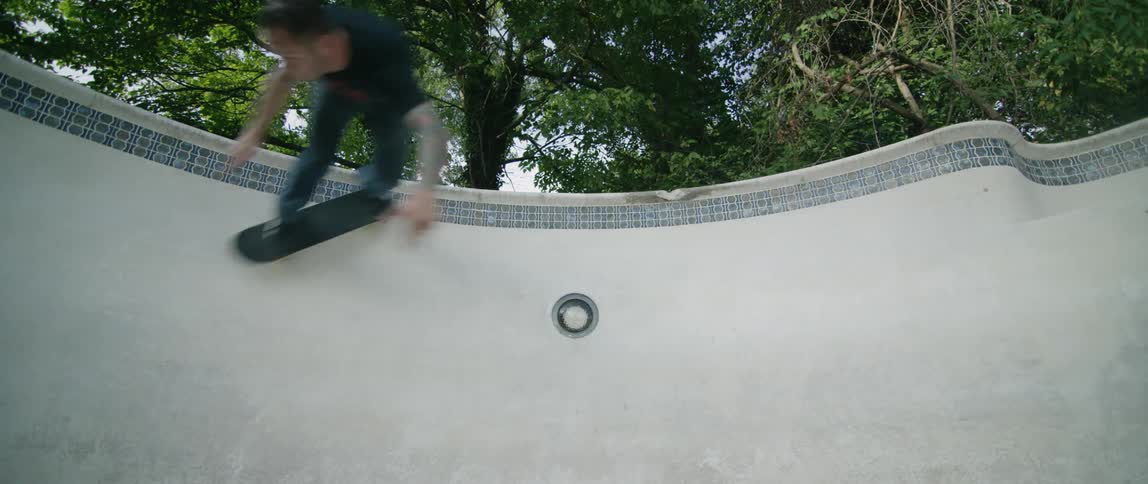 A boy is skateboarding