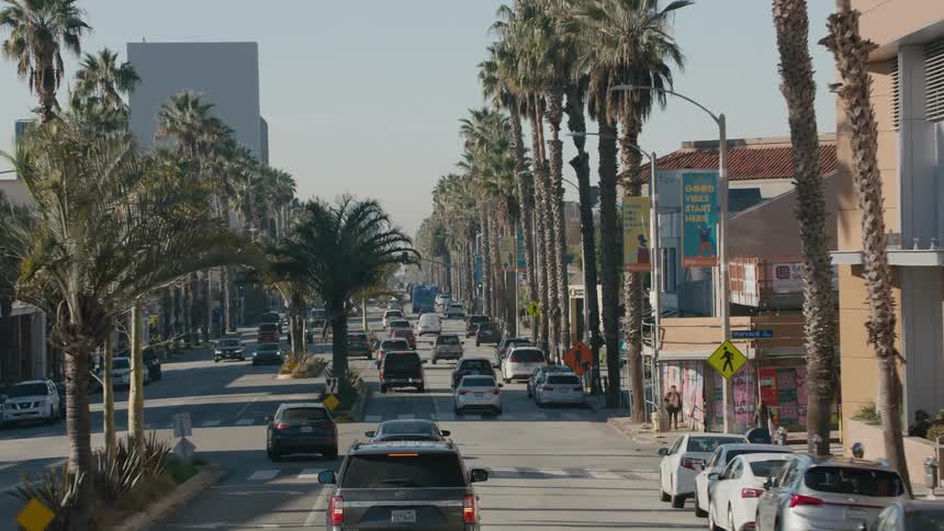 Vehicle drives on highway in busy city street