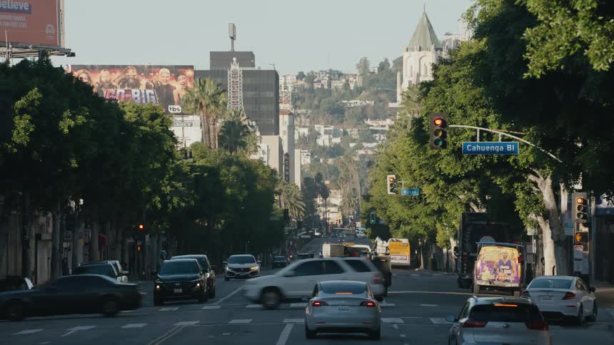 Traffic passes through an intersection heading toward downtown