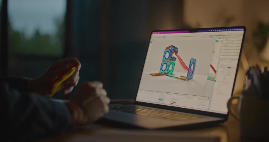 A man is looking at a diagram on the laptop