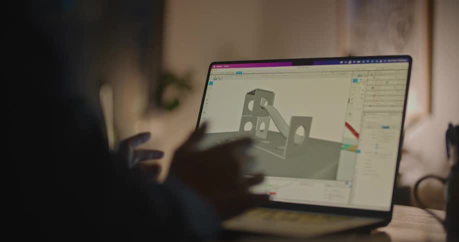 An employee works on a laptop