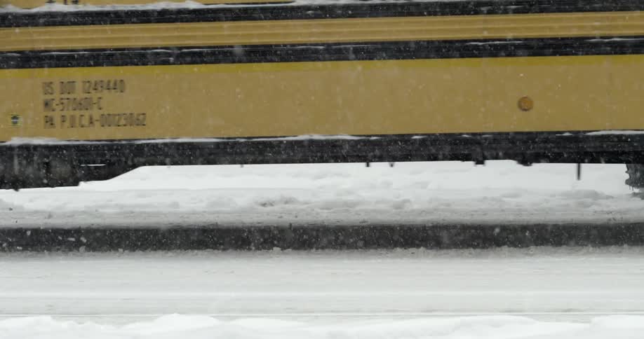 Guy Walking In Snowy City