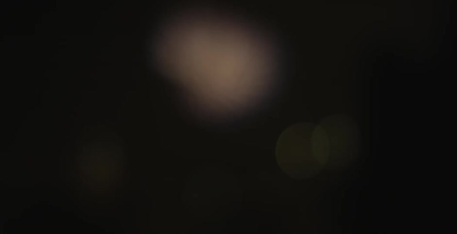 Dark area with blurry lights blinking randomly