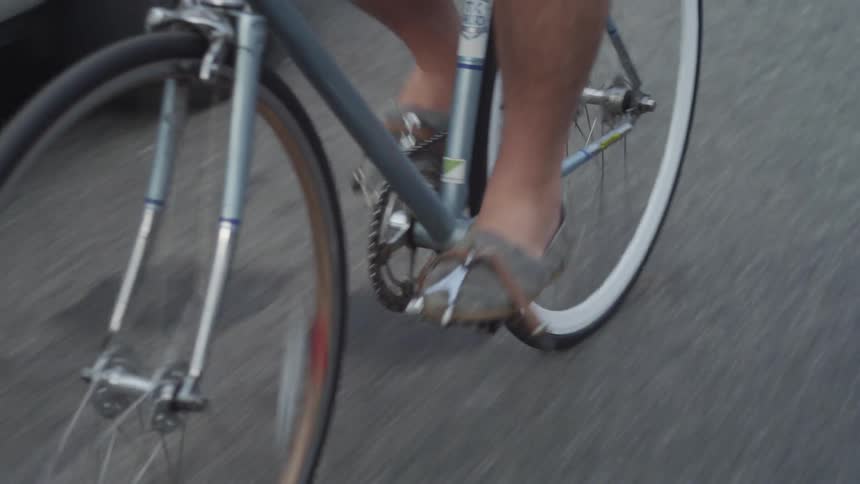Person riding a bicycle down a street