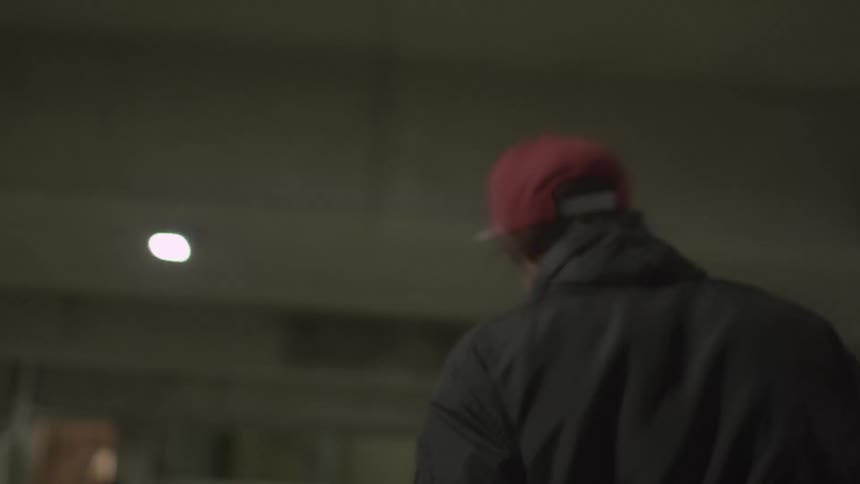 A person in a coat and a red hat