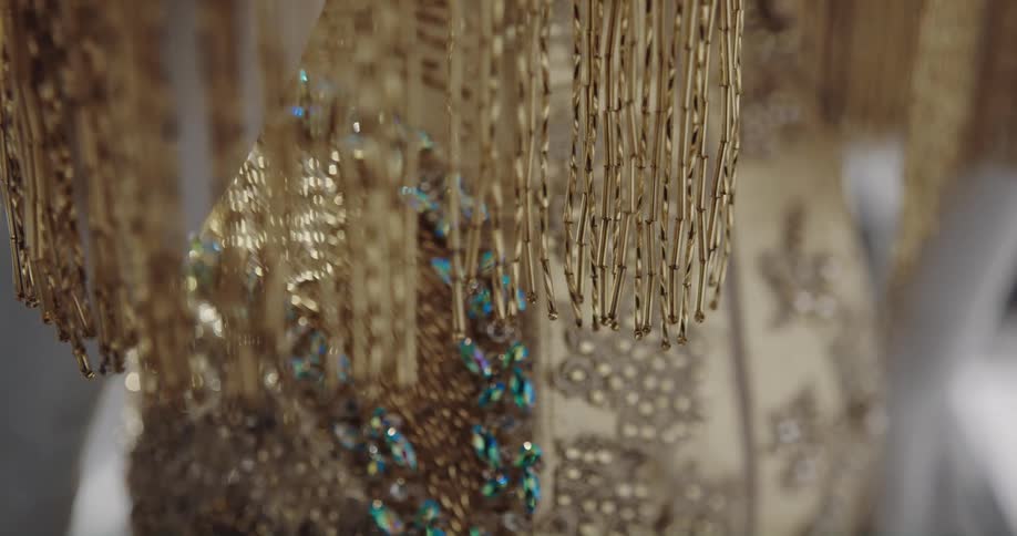 The golden threads hang