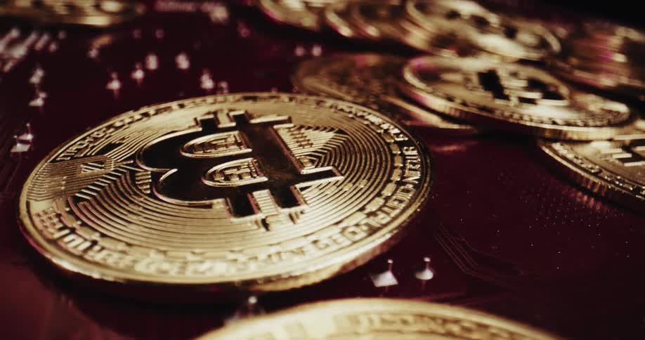 Gold bitcoins shine in the light
