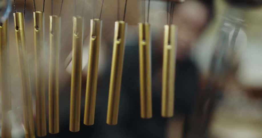 A man using chimes in a room