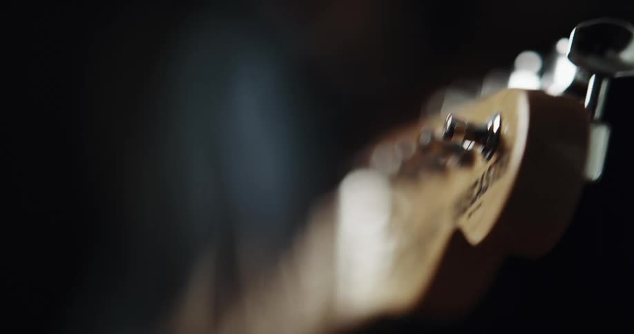 Wooden ukulele is being played