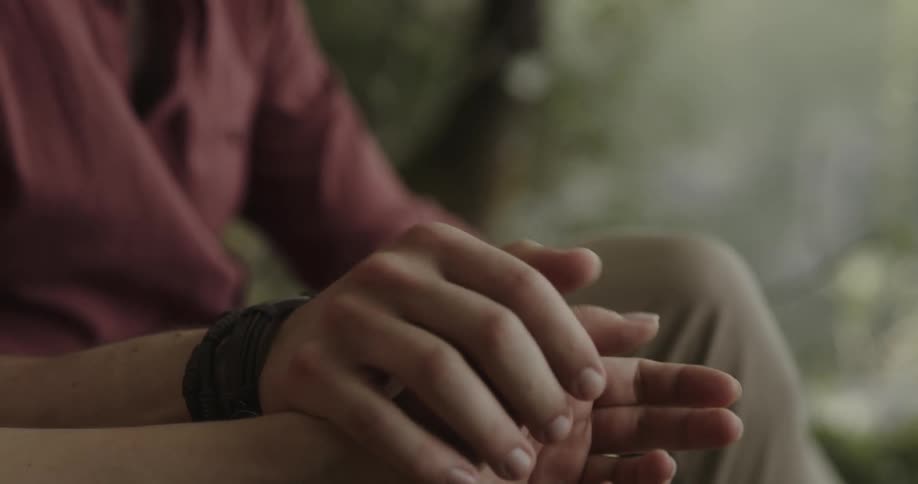 A man holds someones hand