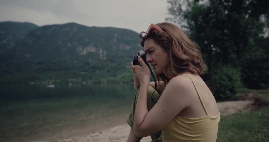 A woman takes photographs outside