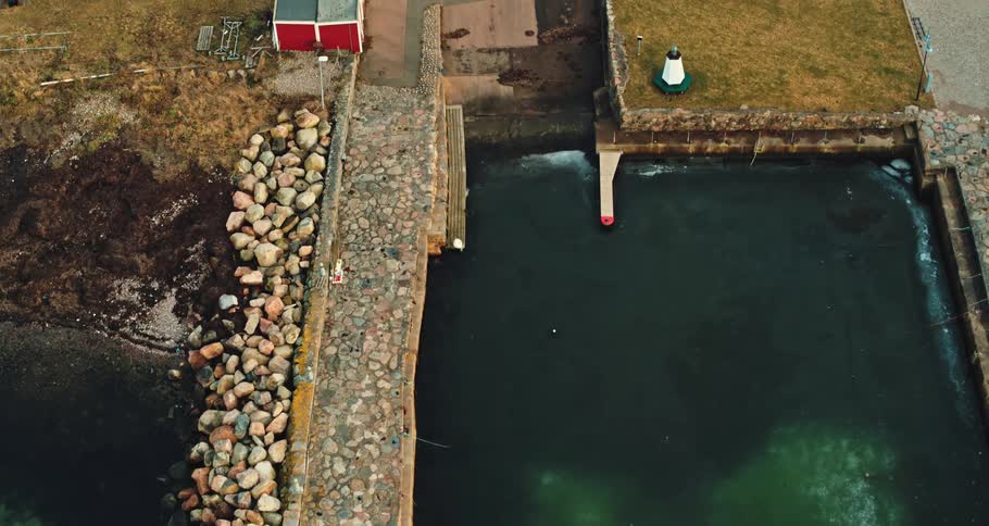 An aerial view of a marina and a coastal town