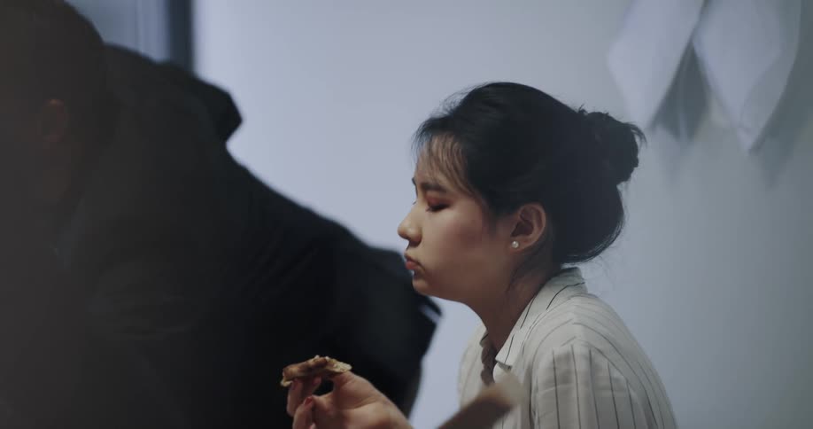Two people are eating at a restaurant together