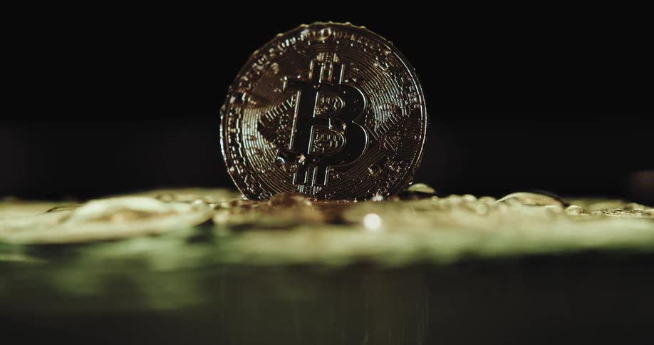 Water flowing over gold coins