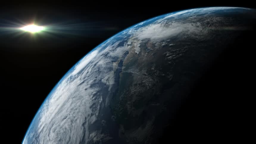 The earth and stars and glowing moon from outer space