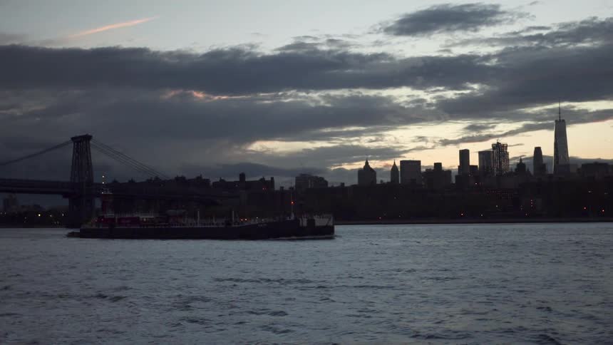 A waterside city after sunset