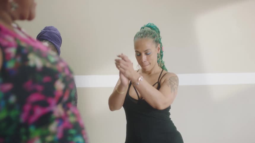 A group of women dancing in a room