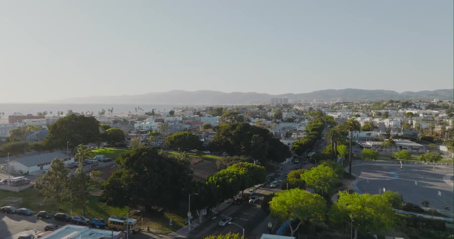 Aerial view of the traffic on the streets of a small calm town at morning