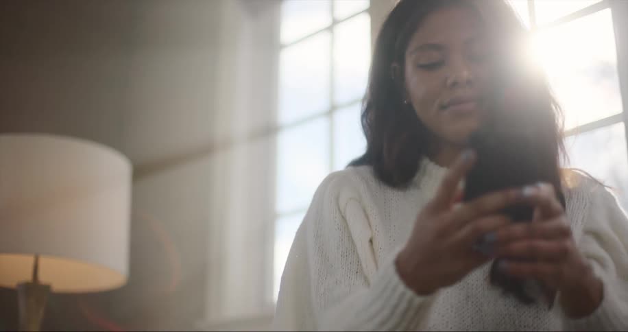 A woman is using her cell phone