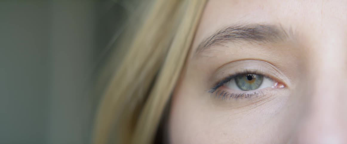 A woman blinking