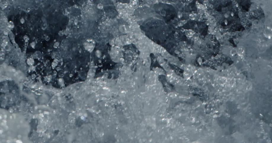 Water forcefully splashes and churns chaotically