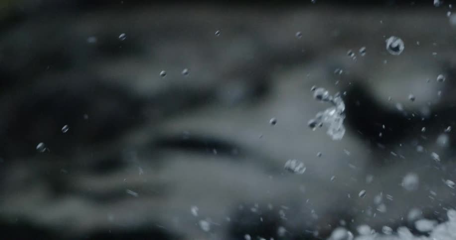 Water droplets are suspended as they free fall down a turbulent river