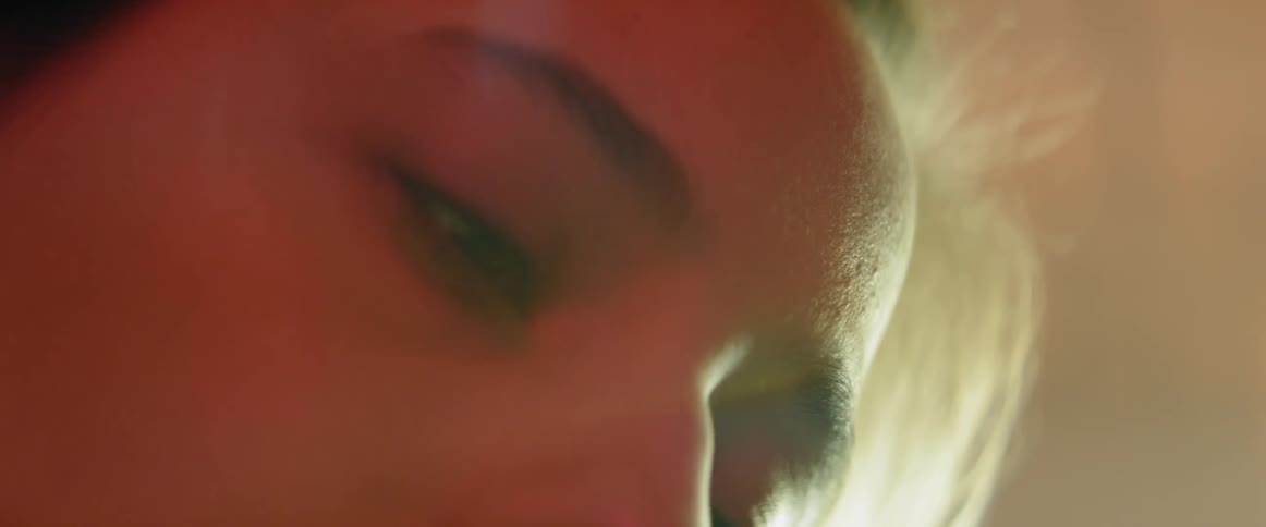 Close up of a woman's face as she looks down