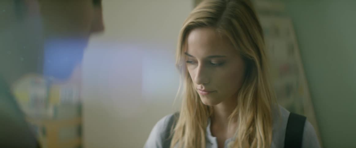 A woman is speaking as another listens