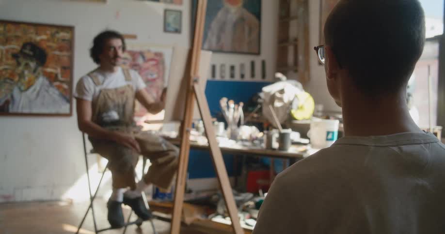A man is posing for a painting