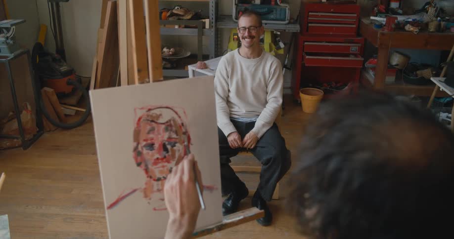 A man is painting a portrait