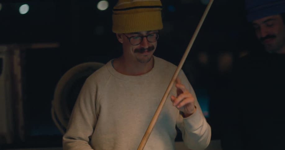 Men are playing pool