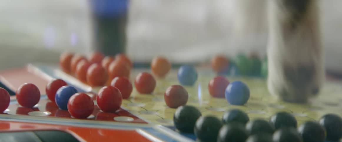 A cat walks on a game board