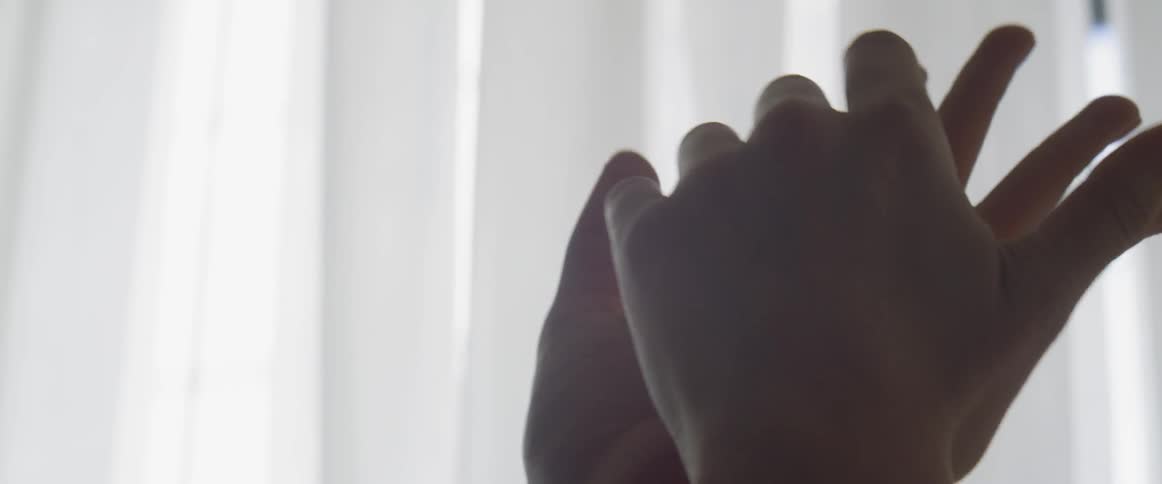 Two hands are touching each other
