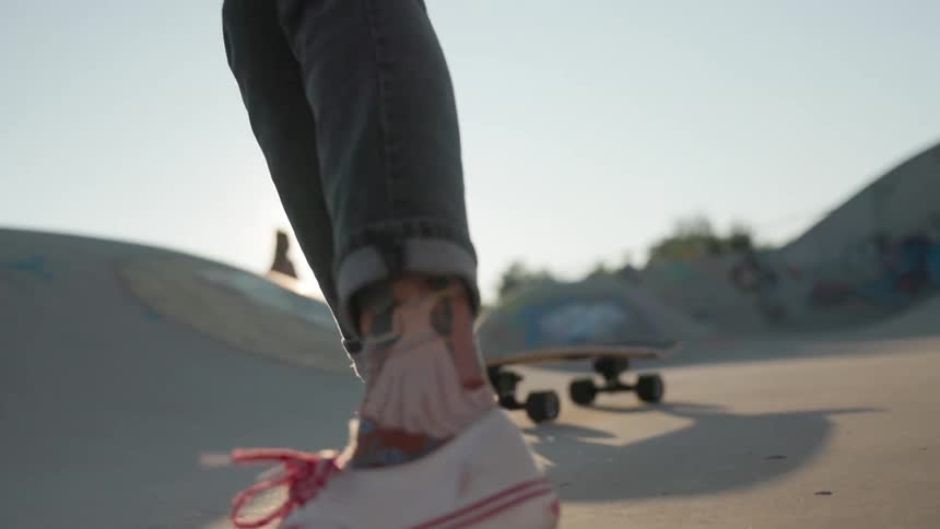 A man falls off his skateboard